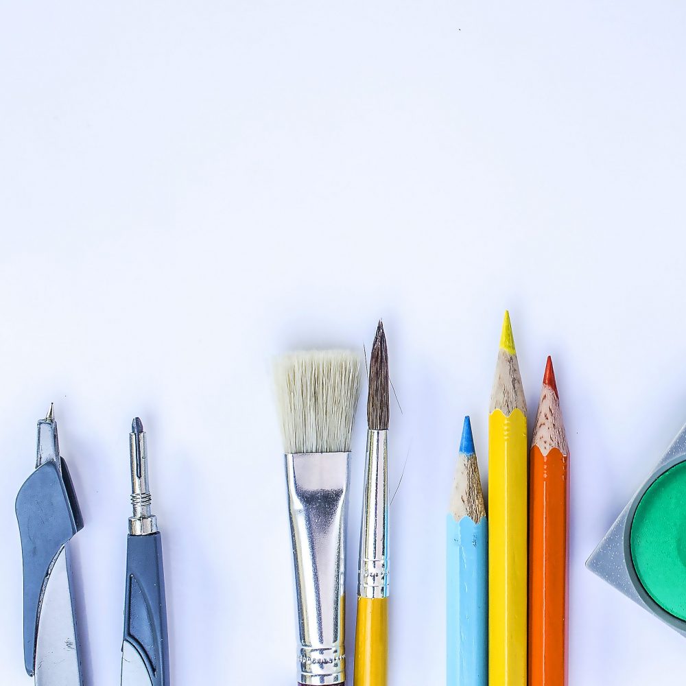 pens and pencils and paint brushes