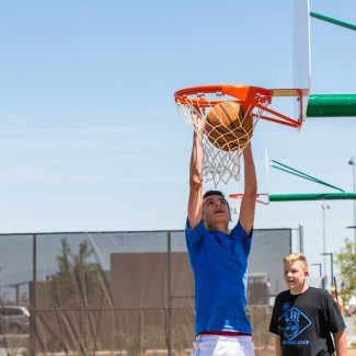 kid dunking basketball