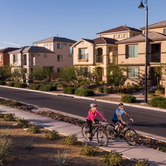 couple riding bikes in neighborhood