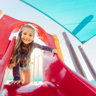 girl about to go down slide