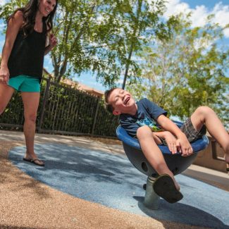 kid spinning in park