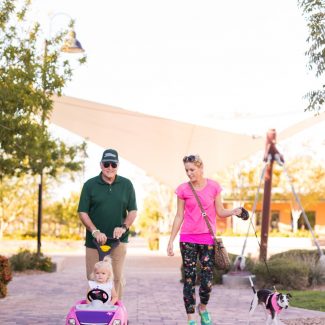 family walking through solista park