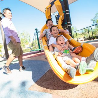 kids sliding down slide