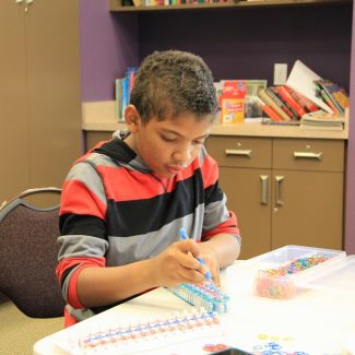 kid doing stem activity