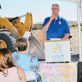 man speaking at groundbreaking of pinecrest academy