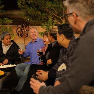 adults having a dinner party