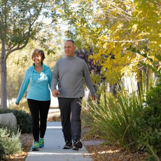 older couple walking to par