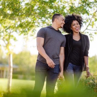 couple walking through park