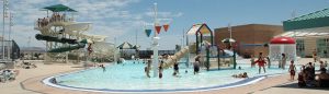 community pool with playground and slides