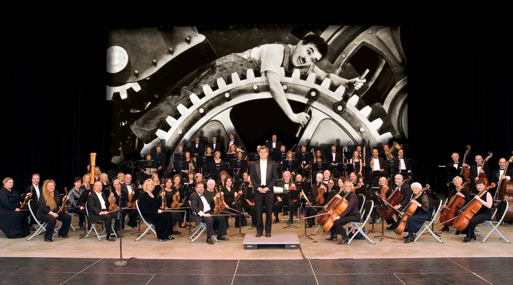orchestra in front of charlie chaplin image