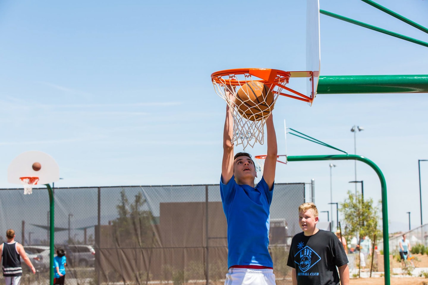 kid dunking basketball