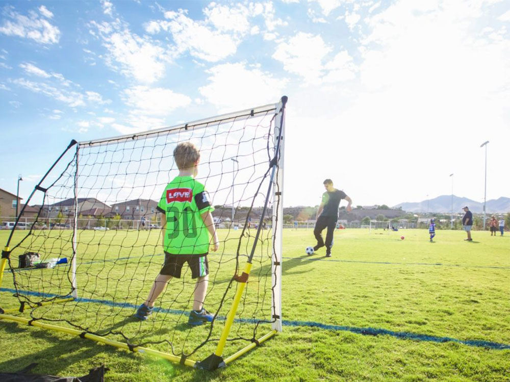 practicing soccer at neighborhood field