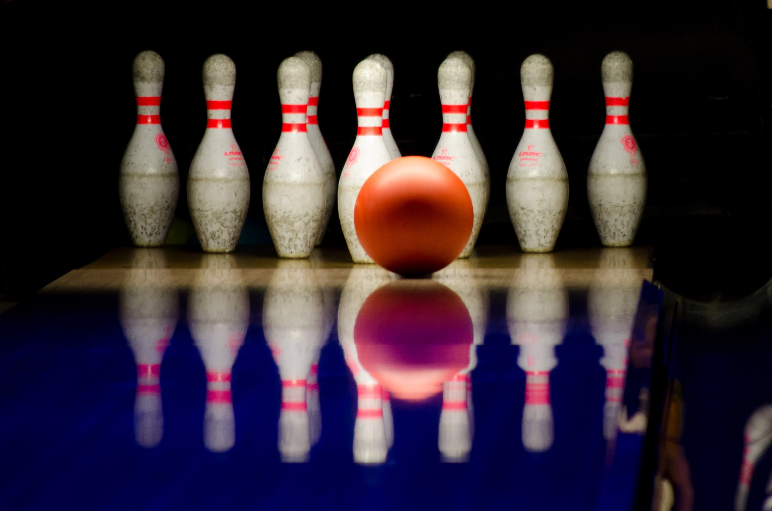 bowling ball about to hit pins