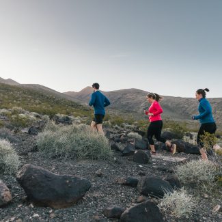 group running up mountain