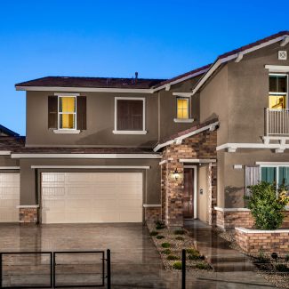 Exterior of a 2-story house with blue sky.