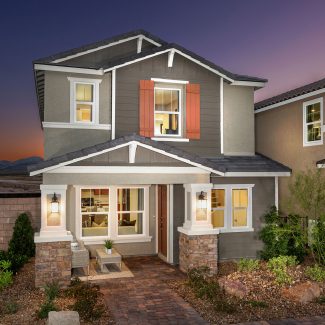 Exterior of quaint gray house in dusk.