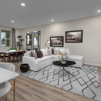 Open floor plan living room with white furniture.