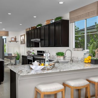 A home kitchen bar with a window outside.