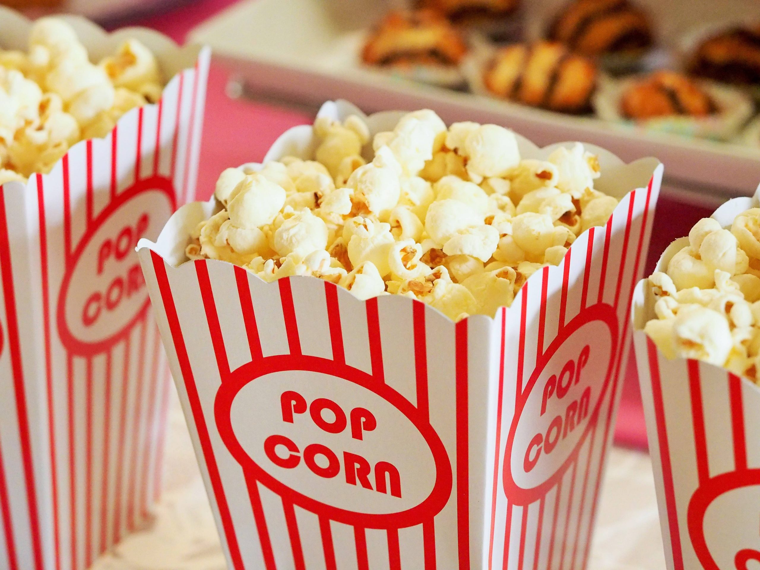 Popcorn in a red and white striped container