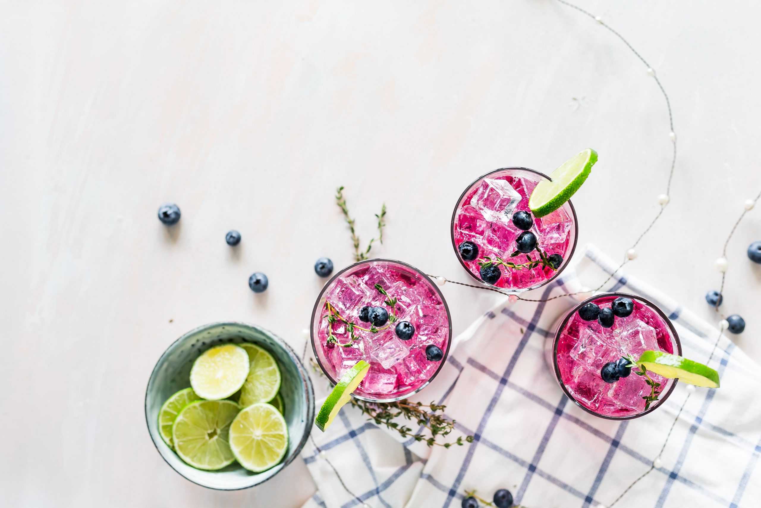 Three colorful drinks on a white background.